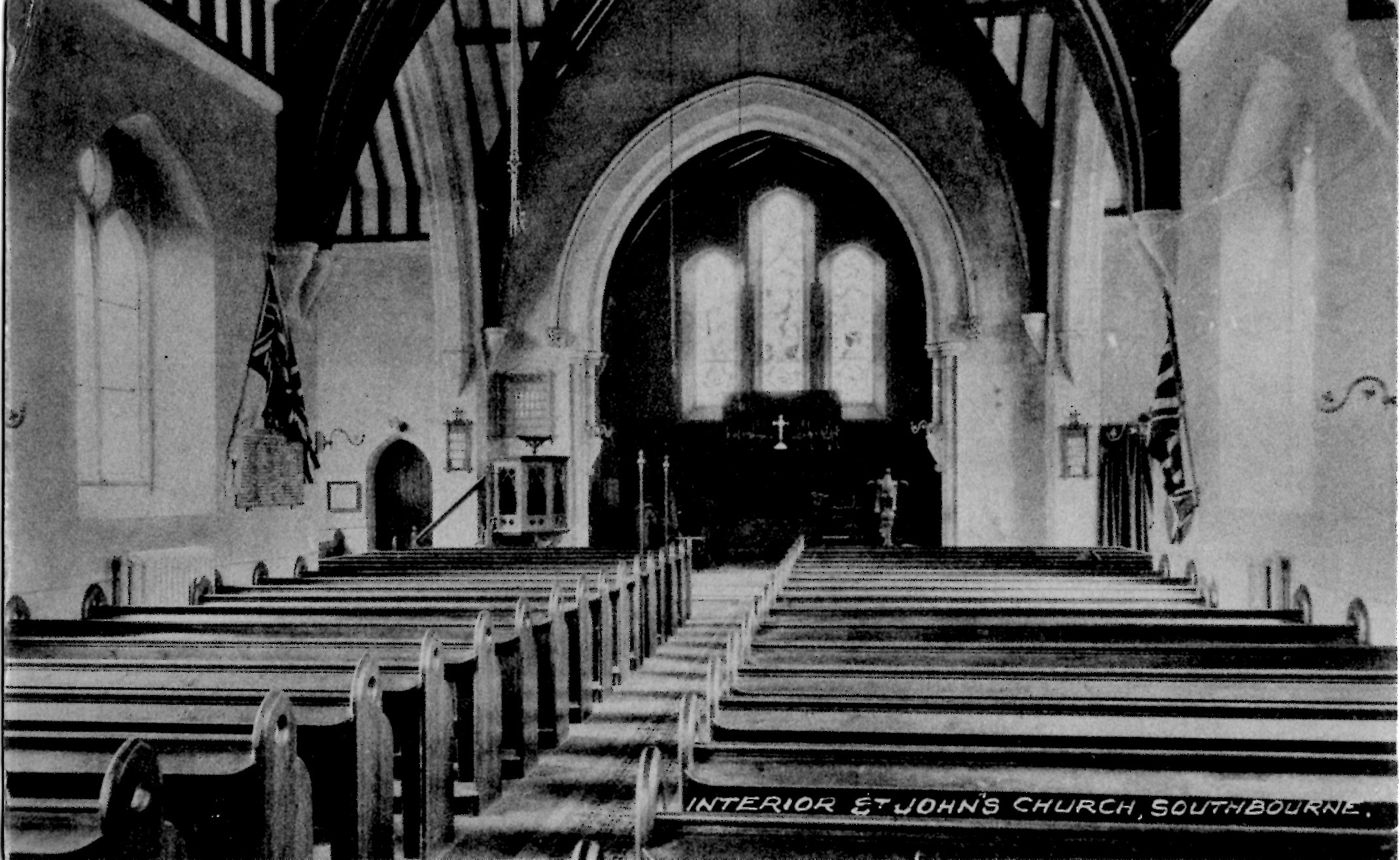 Interior or St. Johns 1926, with pews. 